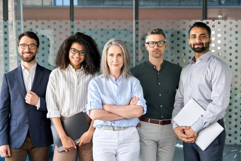 Five people standing in a line