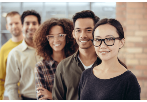 Group of 5 people standing in a line behind each other